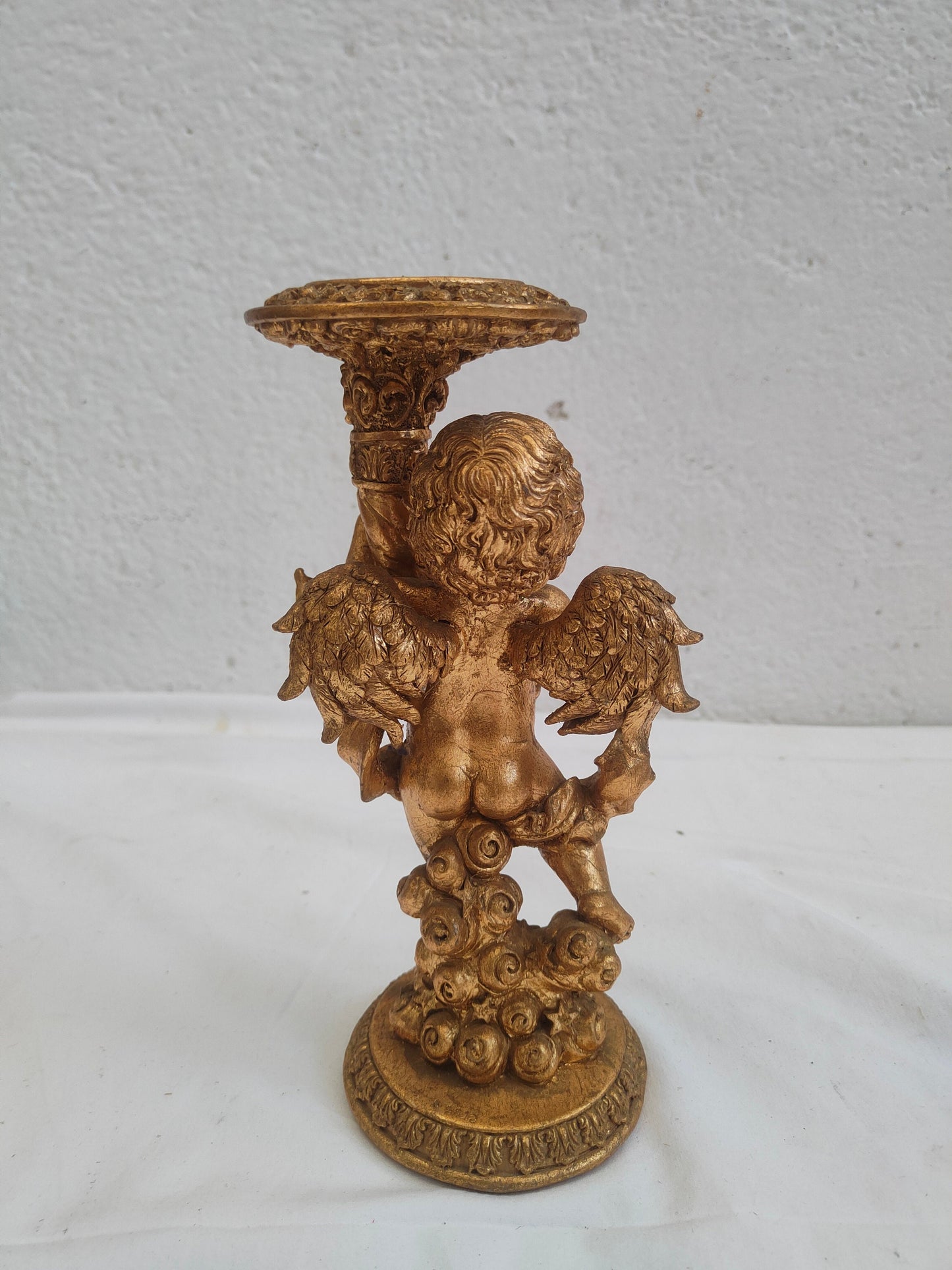 Portacandele rialzina putto dorato in legno e gesso