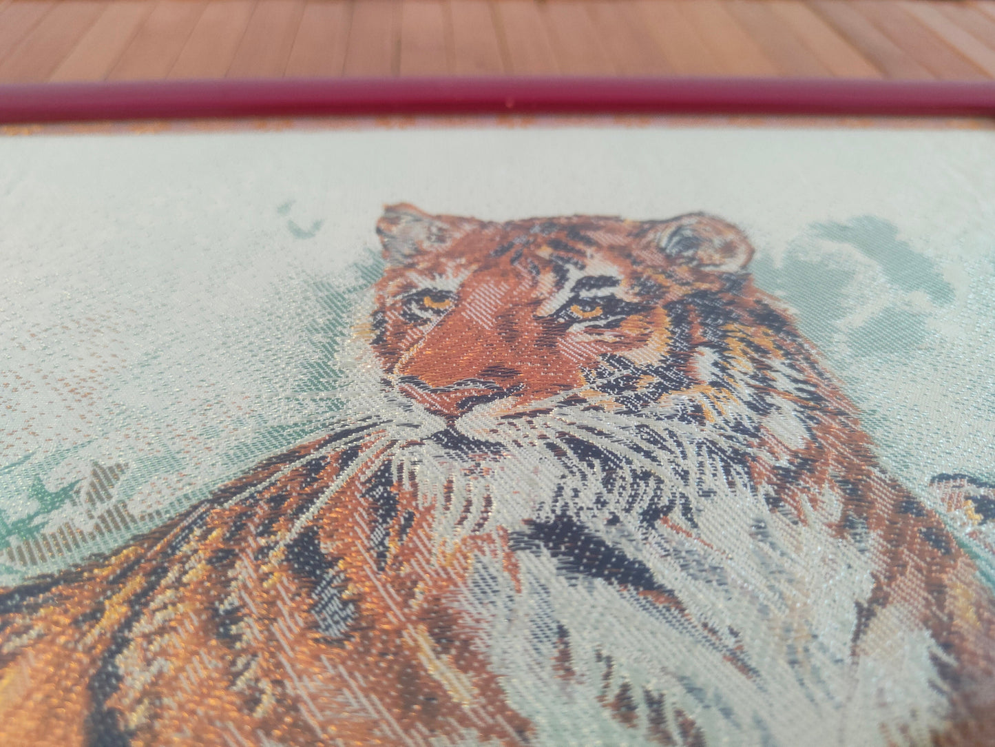 Chinese crochet painting depicting two tigers in a red frame