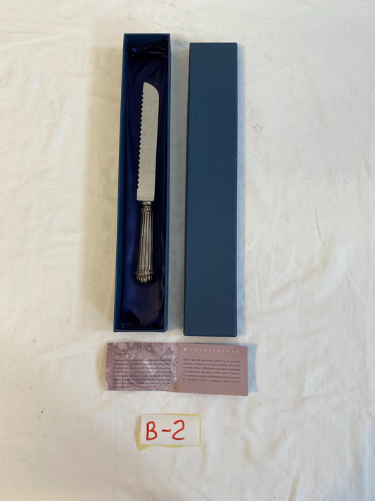 Coltello da torta G. Raspini in argento 925  manico cesellato 29 cm  con scatola originale e libretto cura