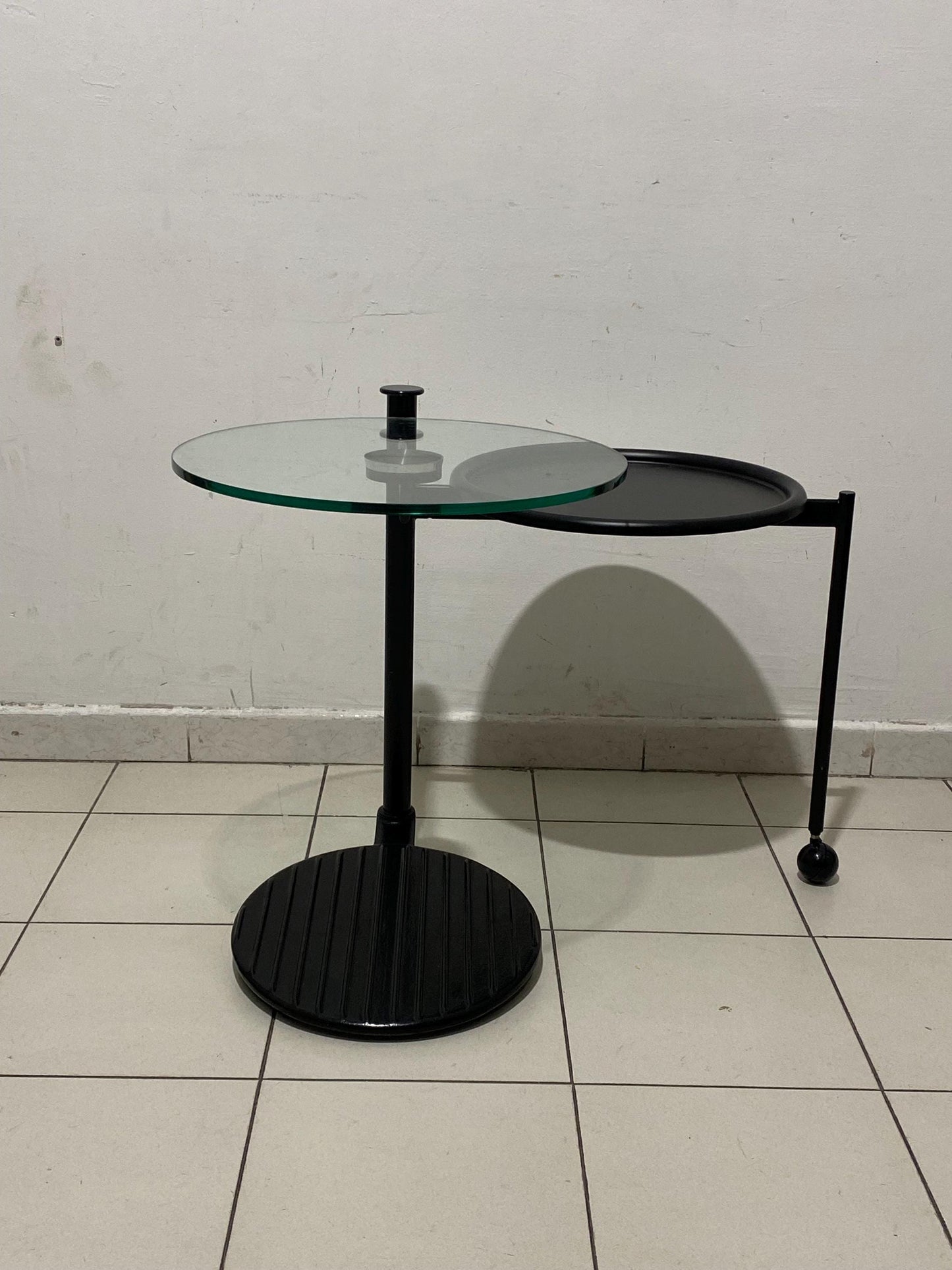 Vintage industrial design coffee table with rotatable glass top Ø45cm h60cm, black metal frame with wheel - 1980s Modern